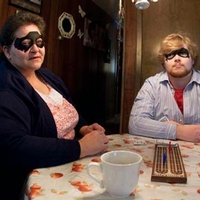 Woman and man sitting at a dining table